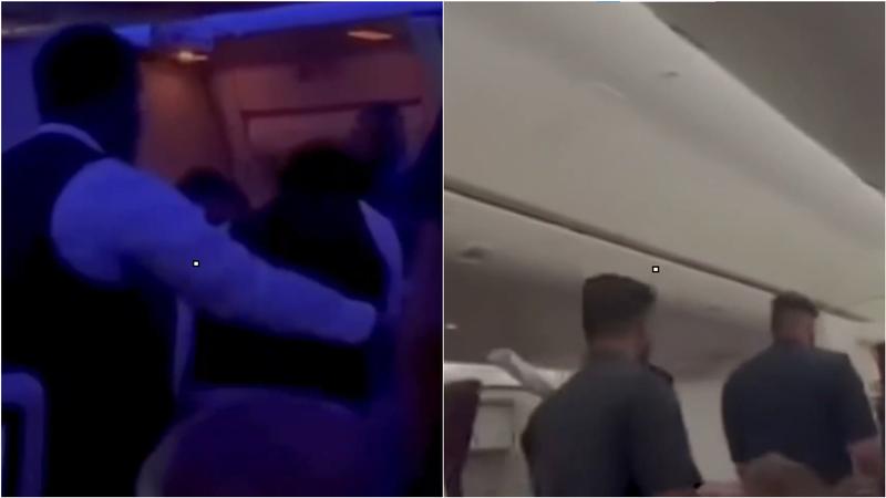 兩名男子在飛機上大鬧後被制伏,並在飛機降落後被杜哈政府帶下飛機。(圖/翻攝X@JMChyno)