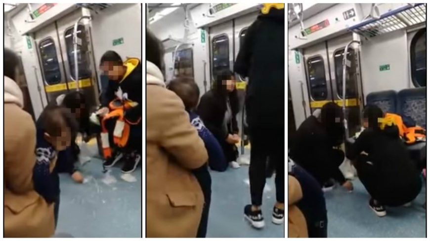 最美風景！小嬰兒搭火車吐奶　女孩跪地幫擦拭地板