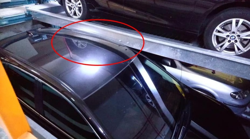明顯看到休旅車的車頂,已經超過限高頂到別台車。(圖/翻攝自「爆廢公社」臉書社團)