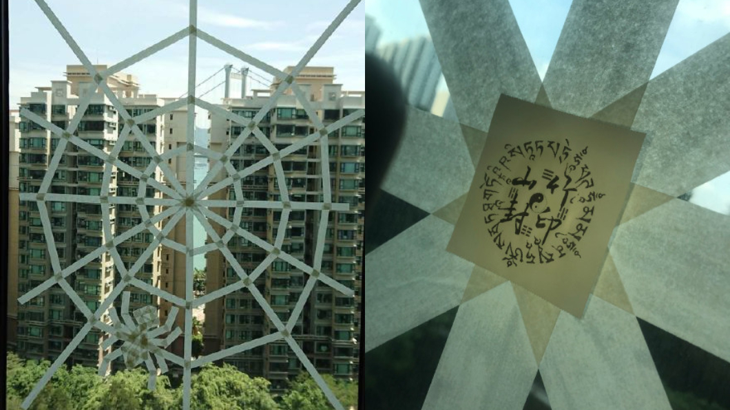 用膠帶貼出「蜘蛛網」 香港民眾防颱苦中作樂