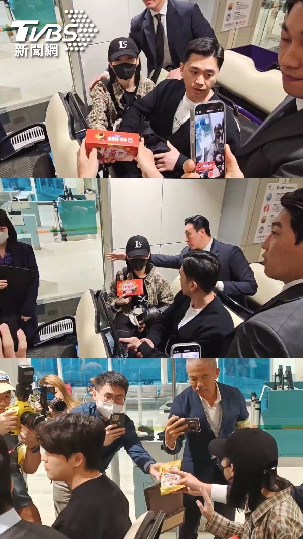 粉絲陸續送上義美小泡芙,IU相當親切地收下。(圖/林志偉攝)