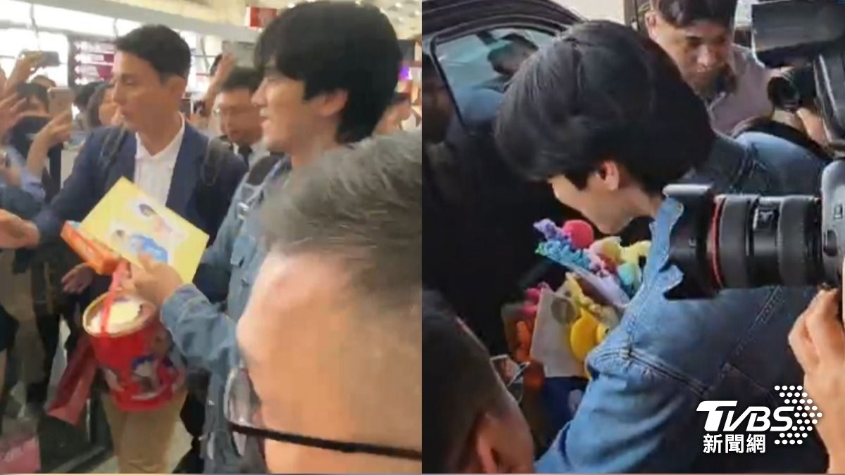 安普賢收下粉絲送的乖乖桶,上保母車時已經滿手禮物。 (圖/TVBS)