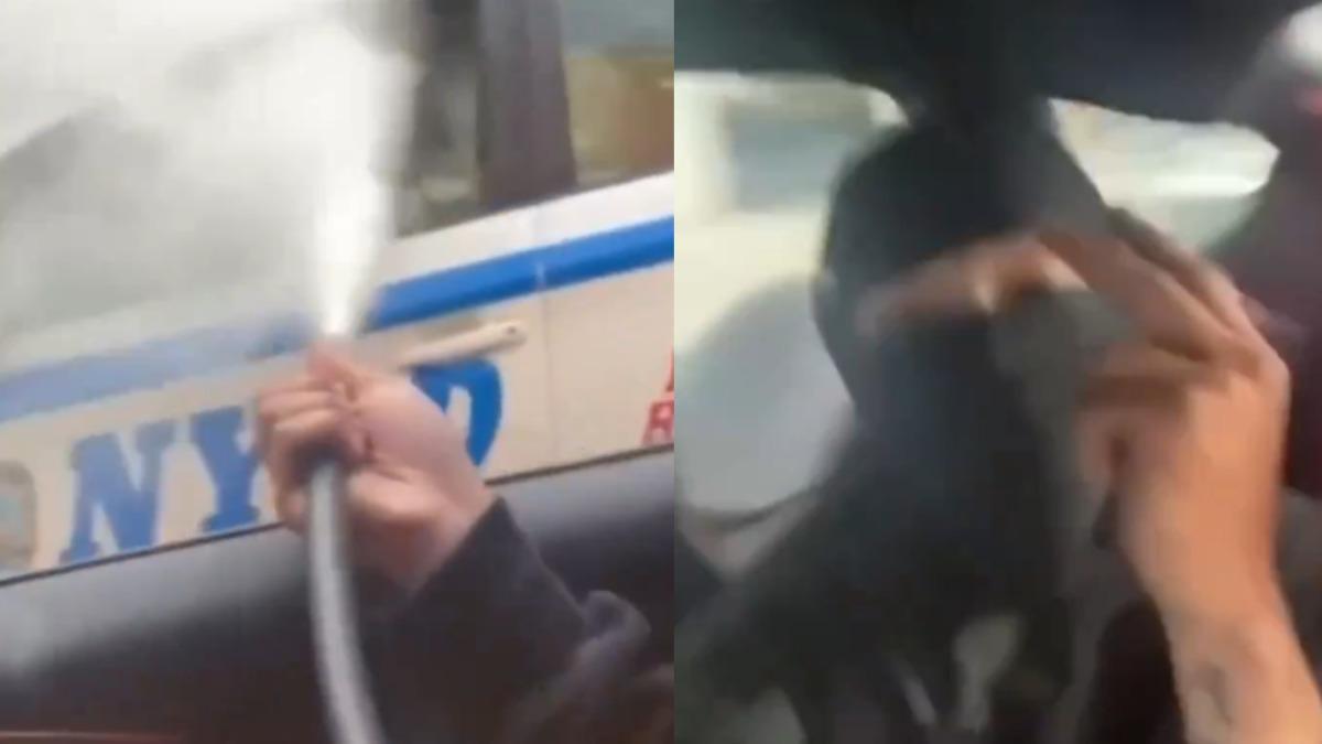 有片/紐約街頭襲警!蒙面男朝警車狂噴滅火器 還囂張比勝利手勢