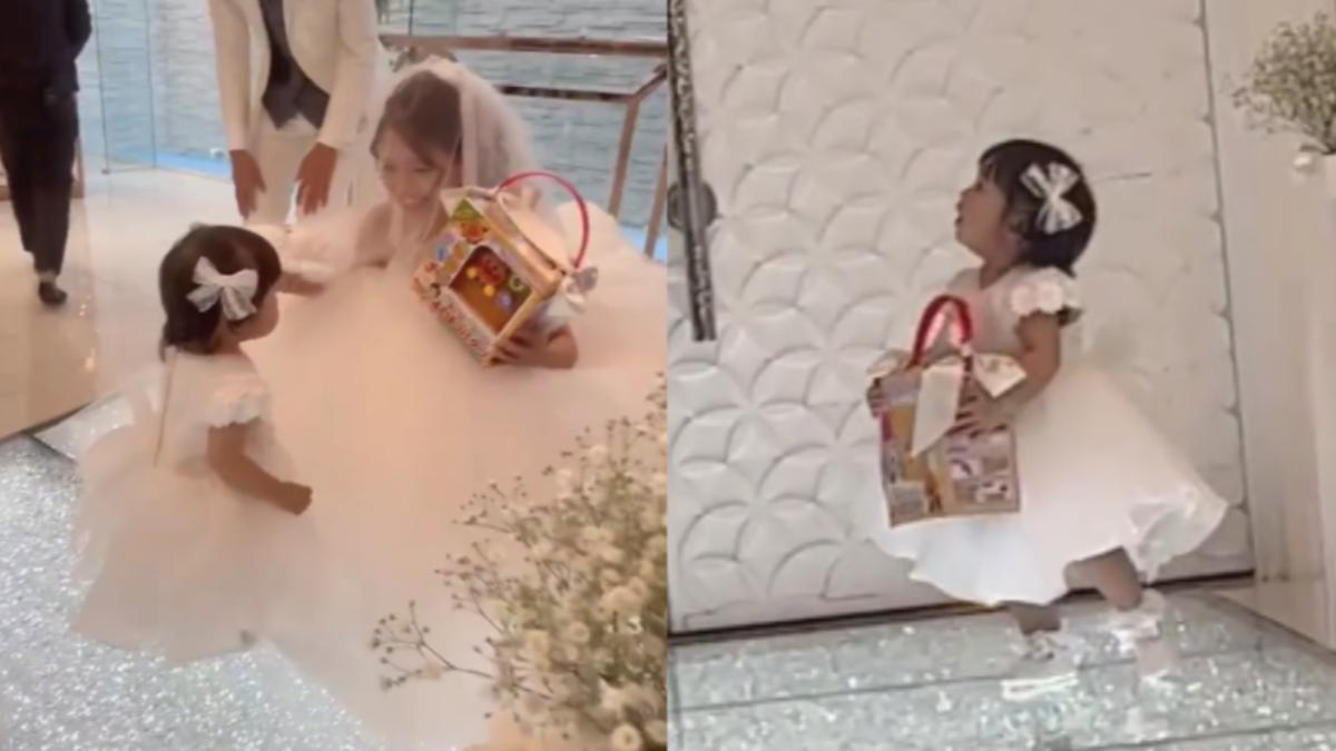 日本1歲小花童開心抱回麵包超人玩具。(圖/翻攝自TikTok @sfy.0321)