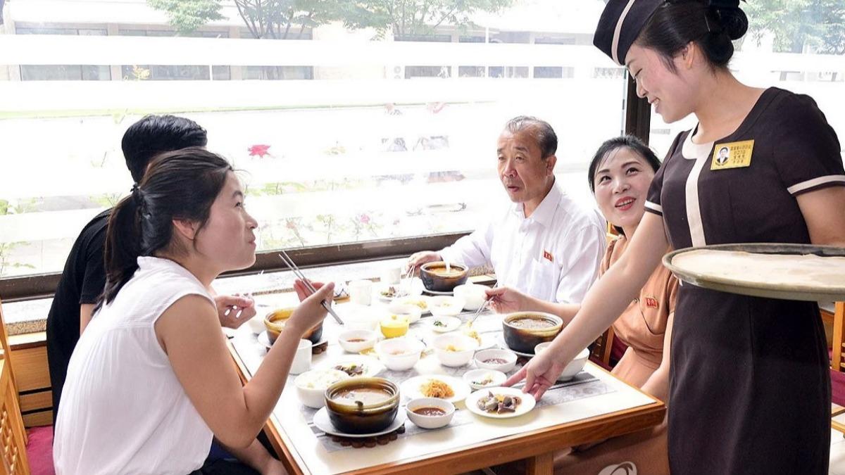 北韓鼓勵民眾食用狗肉,除了基於發展傳統飲食文化,也因為食物匱乏。(圖/擷取自韓聯社)