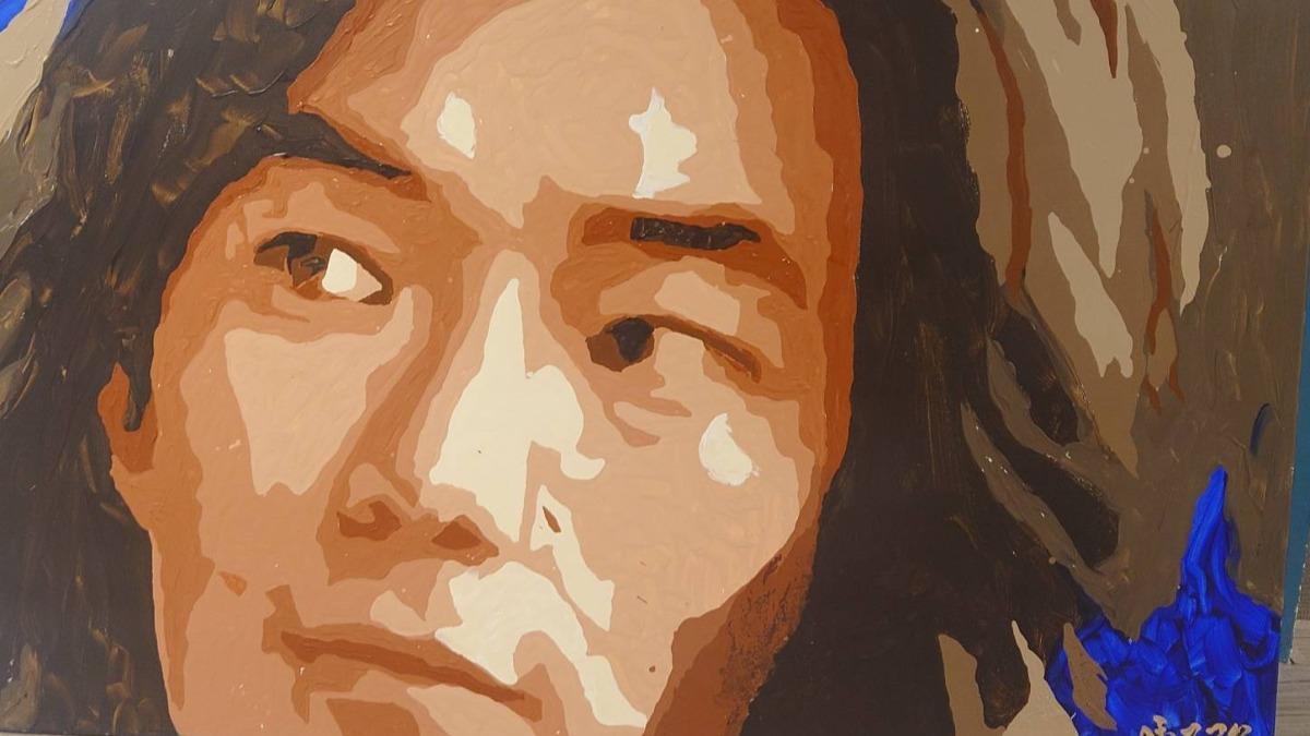 董事長林水成收藏偶像任賢齊的肖像。(圖/藝益藝能公司提供)