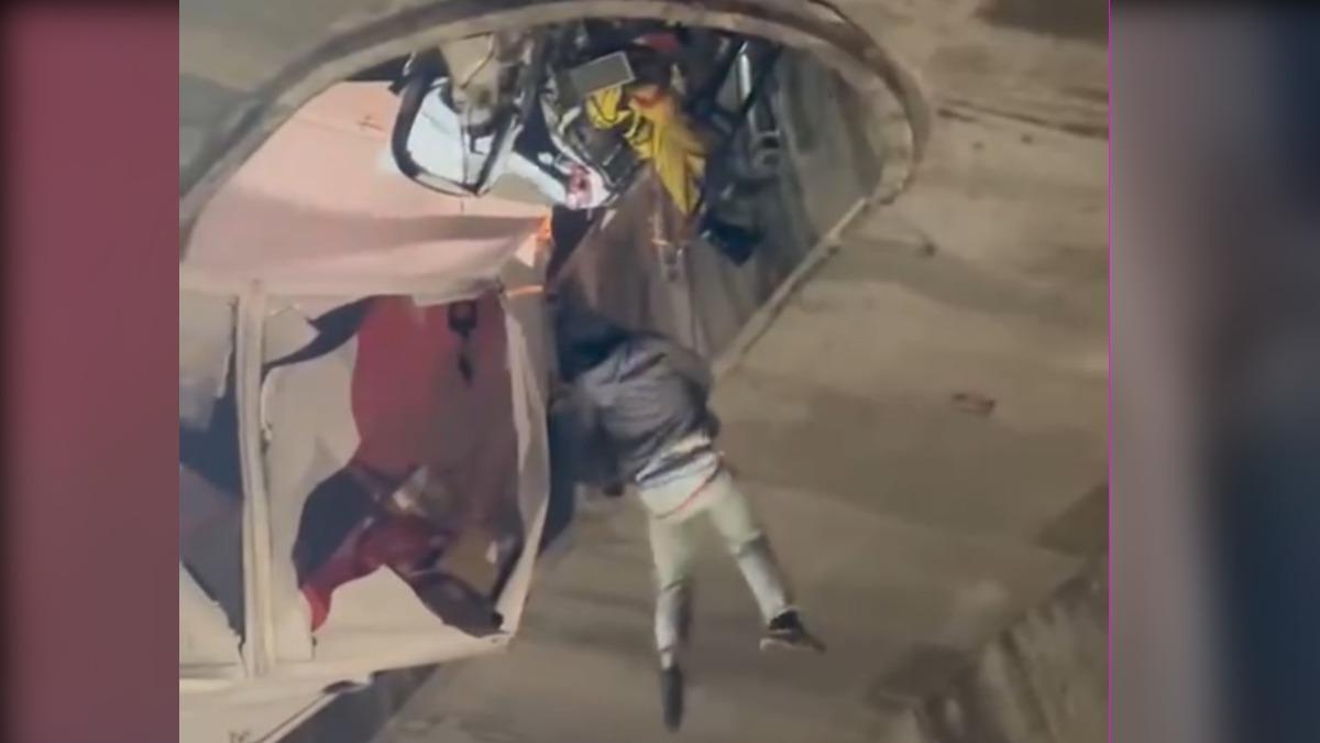 警消將盧男從毀爛的駕駛座救出,半空中吊掛至地面。(圖/翻攝自thread)