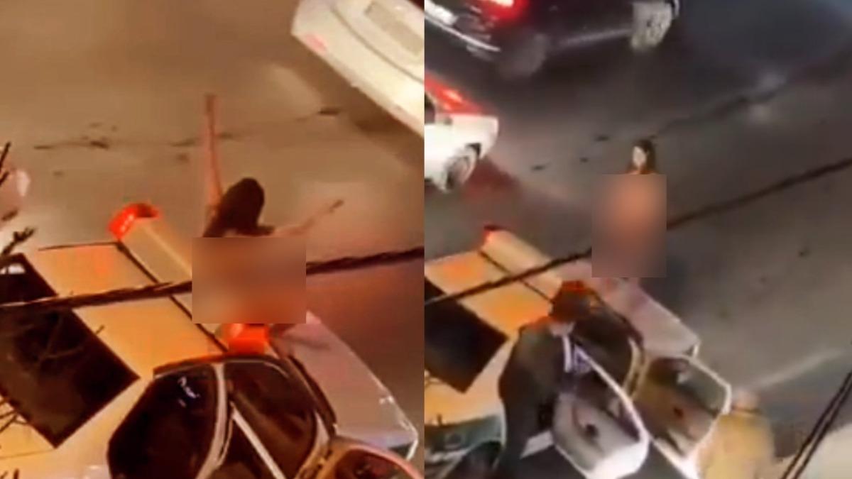裸女跳上伊朗警車抗議!對峙持槍警察 網猜她為一件事激進示威
