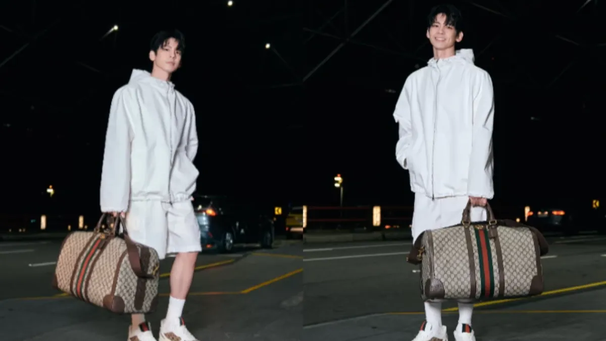 GUCCI品牌好友林柏宏穿著一套全白的運動套裝，手拎經典Savoy行李袋。（圖／GUCCI）