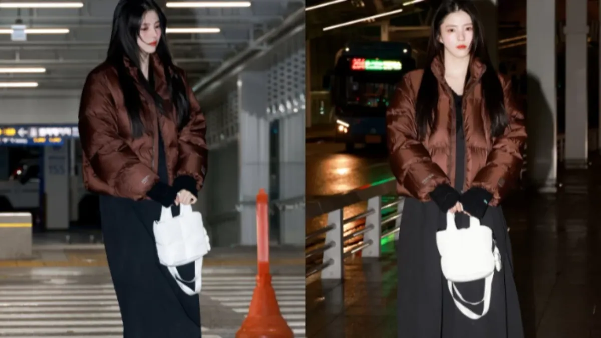 韓韶禧穿上棕色的短版羽絨外套內搭黑色長裙。(圖/fila_korea IG)