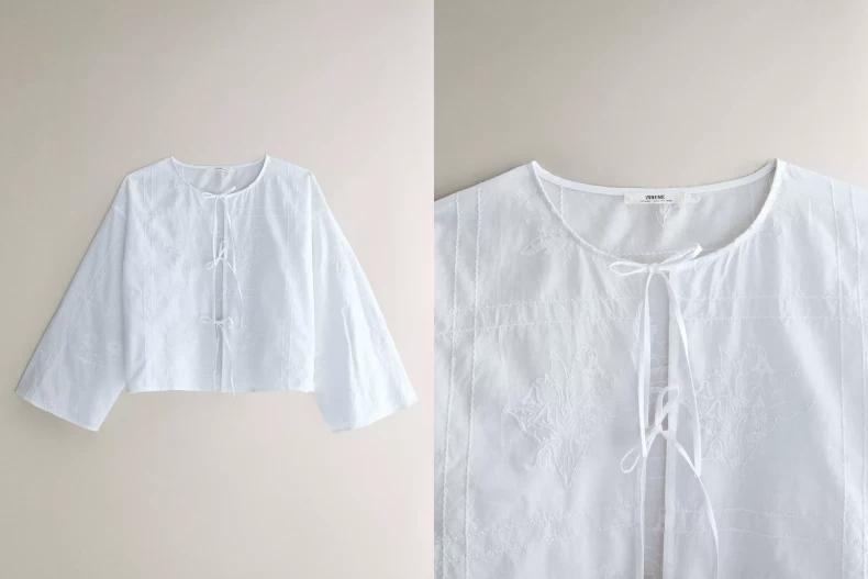 這款純色長袖棉質襯衫以精美的花卉刺繡為亮點。(圖/ZARA HOME)