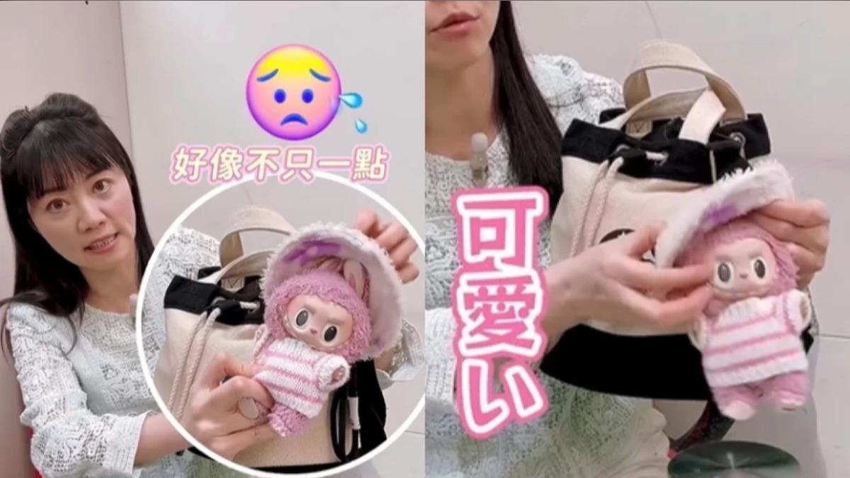 包包外面掛著一隻粉嫩嫩的Labubu娃娃。(圖/翻攝自IG@womanqueen42)