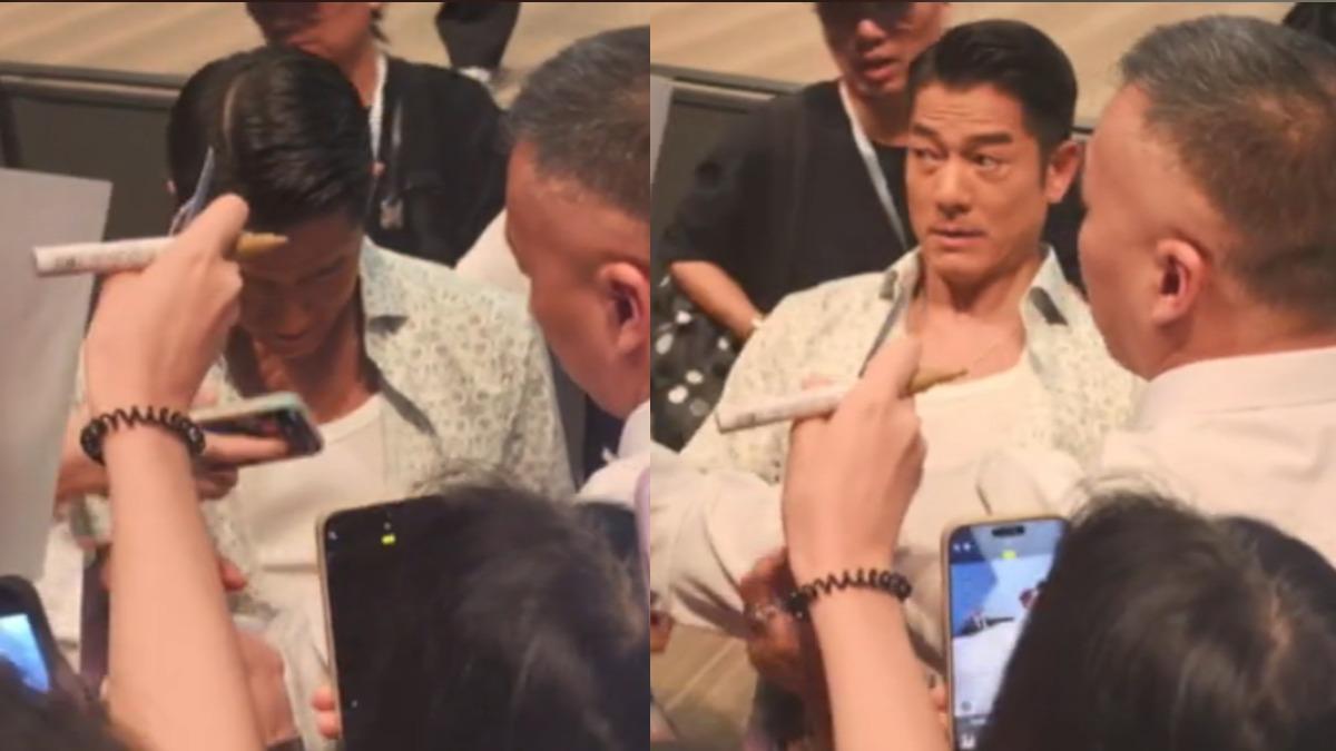 郭富城出席首映活動險遭手機戳中眼睛。(圖/翻攝自微博)