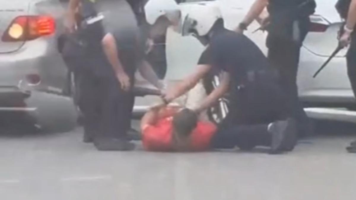 犯嫌遭警方壓制移送法辦。(圖/朱建銘提供)