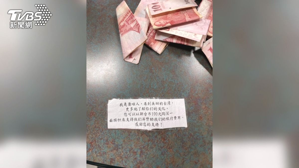 「聾啞」俄女台中賣國旗！議員也買單　遞簡體字紙條騙百元。(圖／TVBS)