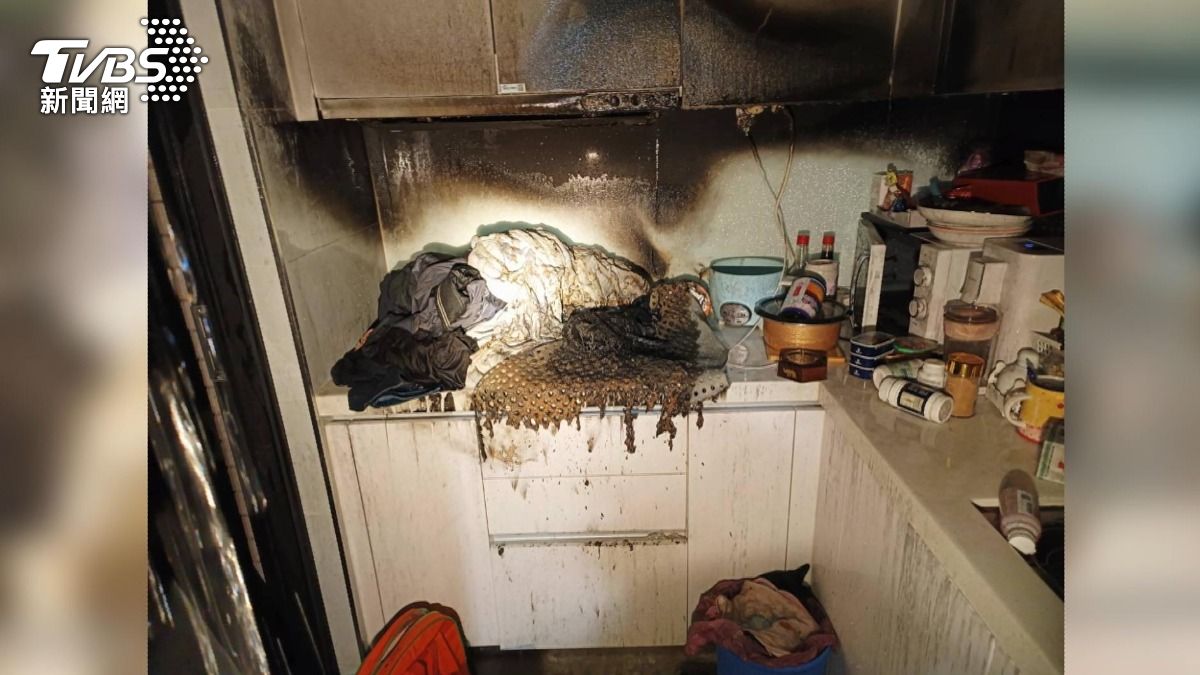北屯高樓爆火警!屋主妻子燒棉被引災,自動灑水系統救全棟。(圖/TVBS)
