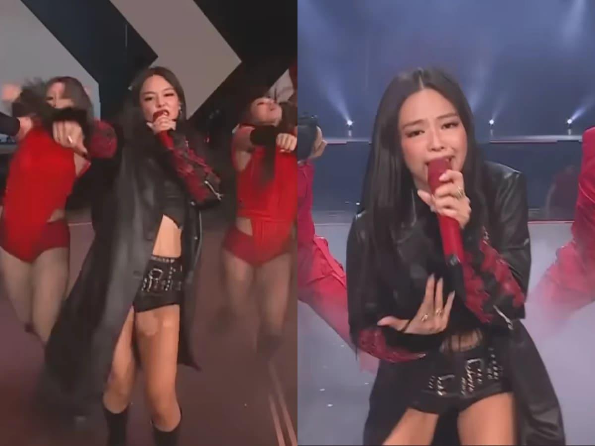 Jennie 這套舞台造型以黑色高領皮革背心短版上衣為核心，不規則下擺自然露出水蛇腰線條。（圖／翻攝自Golden Disc）
