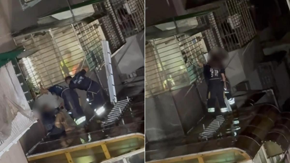 陳姓毒蟲跳窗逃逸結果卡在遮雨棚上,警消到場救援。(圖/TVBS)